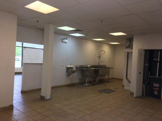 Kitchen of the available restaurant. 1388 Sq. Ft. with lots of frontage windows. Prime space of the Center.