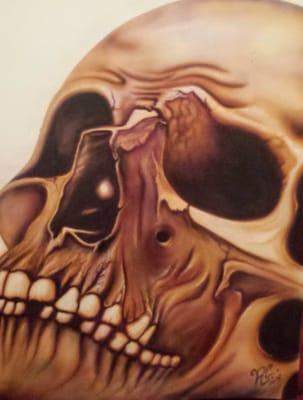 Skull airbrushed on illustration board by Reggie Curtis of Curtis Custom Airbrushing