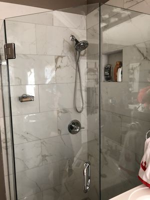 New tiled shower unit with custom glass enclosure