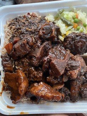 Oxtails, rice and peas, cabbage with mixed veggies