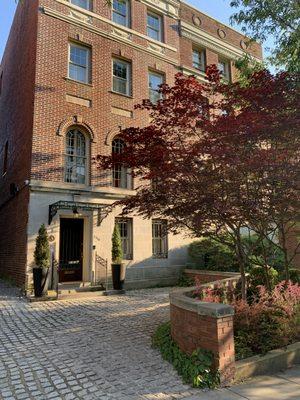 Kalorama rowhouse, entry stonework steel and glass canopy and planting