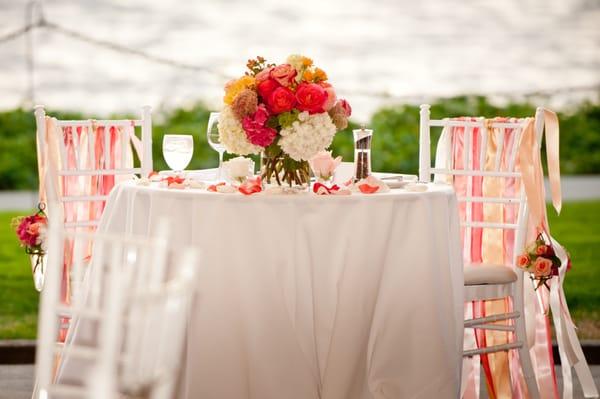 Charming sweetheart table with centerpiece of roses, hydrangea and sedum. Wodmark Hotel, Kirkland WA Carol Harrold Photography