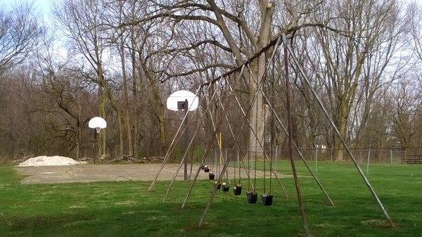 swings and basketball (court was in rough condition)