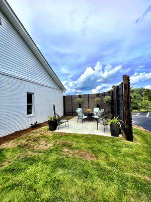 Patio outside the back entrance leading to parking lot!