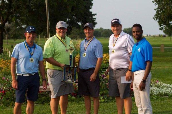 Allstate presenting Golf Scramble Trophy to the winners