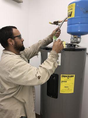 All-City Plumbing technician performs a water heater inspection