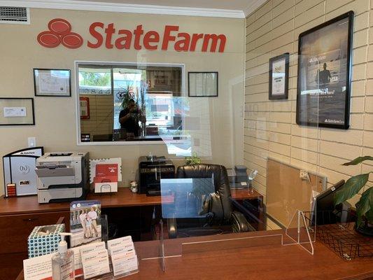 Receptionist area with sneeze guard