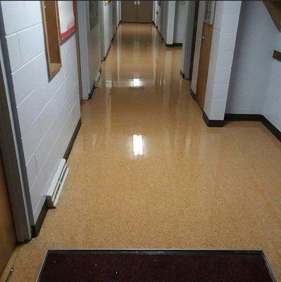 Elementary school hallway stripped and waxed and coated with our scratch free product.