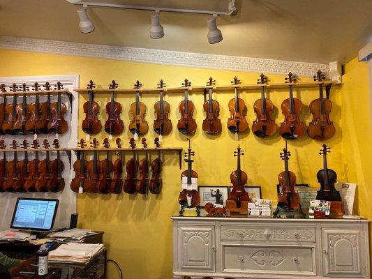 violins. the dark one in the bottom right is made with carbon fiber!! so cool!