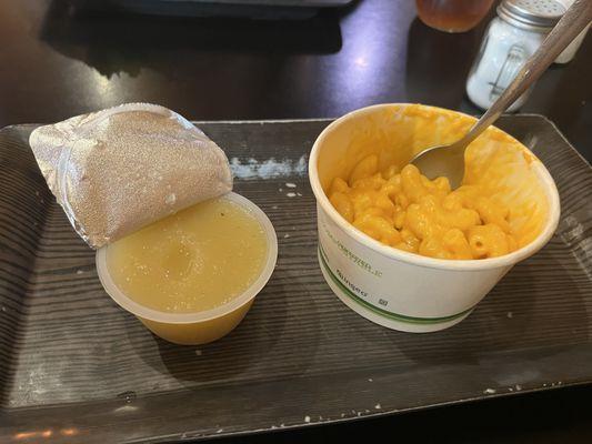 This is the Mac and cheese after they handed it to us. Not even a full cup.