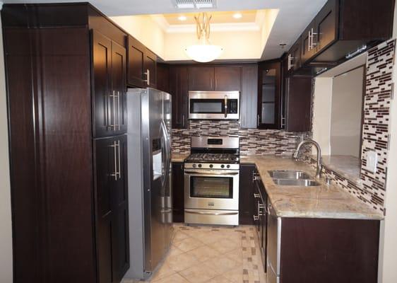 Complete kitchen remodel (cabinets, backsplash, granite counters, flooring and lights)