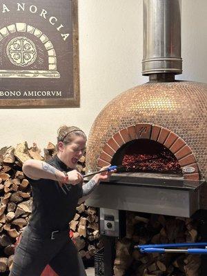 Maria working the pizza....