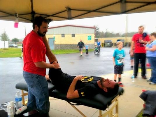 Dr. Brandon stretching runners before the 5k