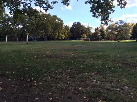 View from the north parking lot looking south. The playground is at the far end.