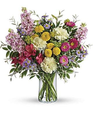 Alstroemeria, light yellow carnations, pink stock, hot pink matsumoto asters and large lavender monte cassino asters.