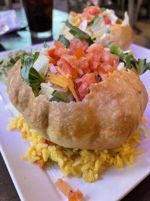 Puffy taco on a thin layer of rice