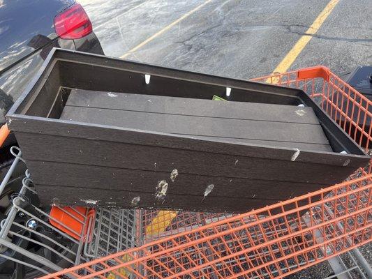 Raised planter covered in bird poop.