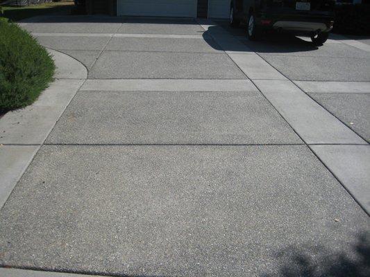 Exposed aggregate driveway with broom brushed borders