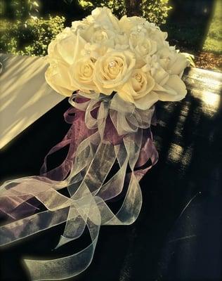 White roses and stephanotis with a touch of sparkle