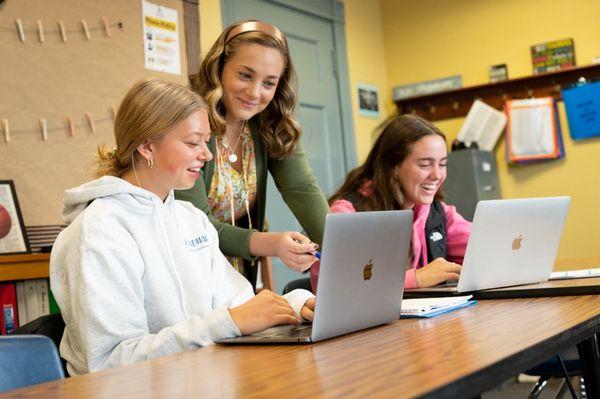 Teacher working with students in small classes of 6-8 students