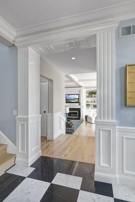 doorway: paneling below and fluted columns above