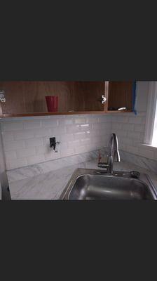 Here you have an entire backsplash that we installed and grouted...