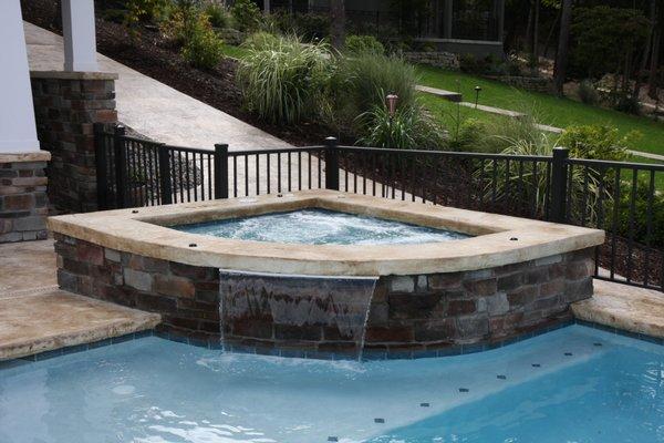 Custom gunite spa with water feature.