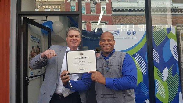 Marcel and Dirk hold the Mayoral Citation that we received for our service to the community. Greatly honored!