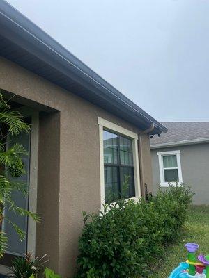 Part of the gutter running the span of our back roofline, along with a downspout that matches our paint. So happy.