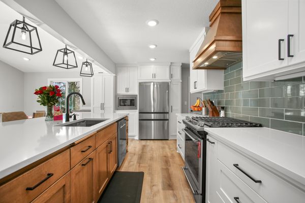 Sleek Kitchen design with both Maple and Paint kitchen Cabinets.