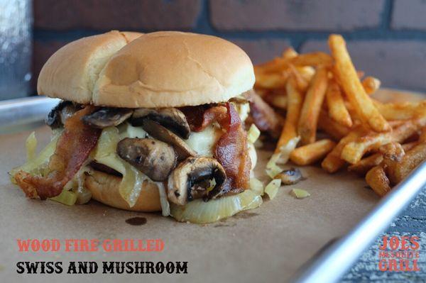 Swiss mushroom bacon burger with zesty fries