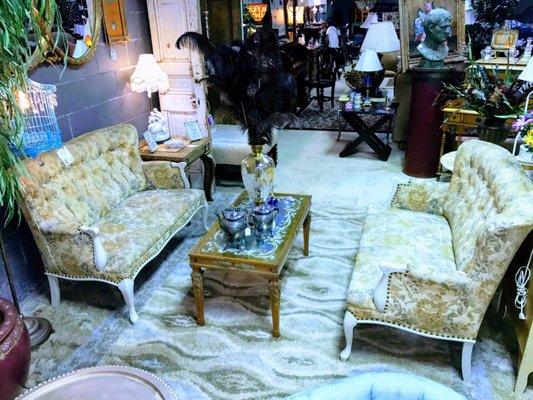 Antique love seats and coffee table