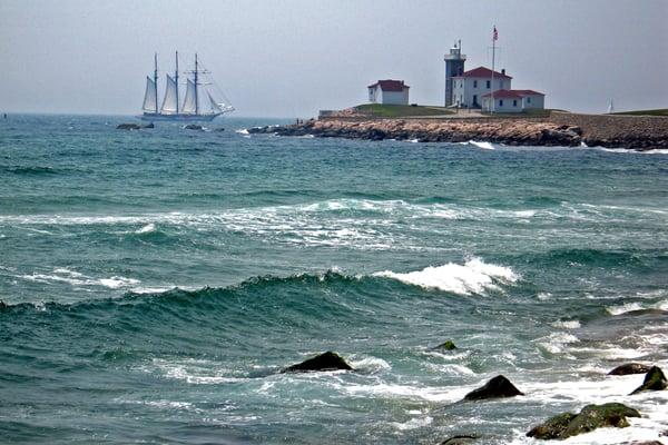 'Tallship Across Watch Hill Lighthouse' by photographer Harris Hanka.