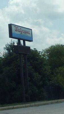 Street signage for entrance to Walgreens