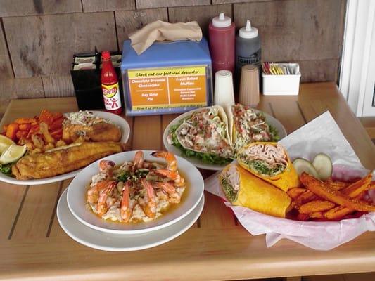 Something for everyone! Pictured here our shrimp 'n grits, seafood platter, fish tacos and the absolutely perfect Cali wrap.