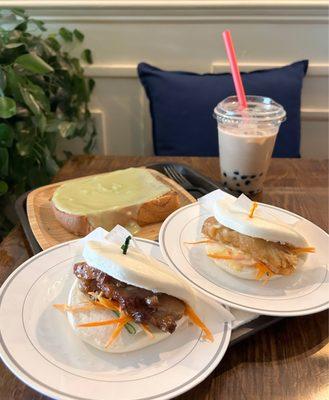 (Back Left) pandan custard toast (back right) regular boba (left) pork belly bao (right) cod fillet bao