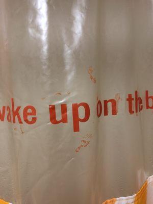 Looks like bloodstains on the shower curtain