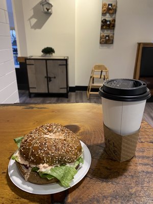 Whole wheat everything bagel toasted with lox cream cheese, oat milk cappuccino