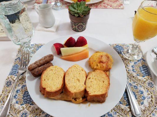 Creme Brulee French toast with cornbread casserole, sausage and fruit