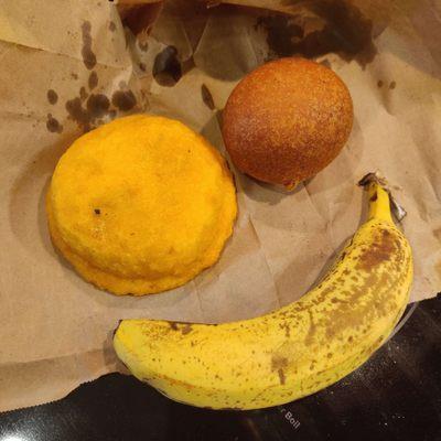 Buñuelo and pastel de pollo (banana for scale)