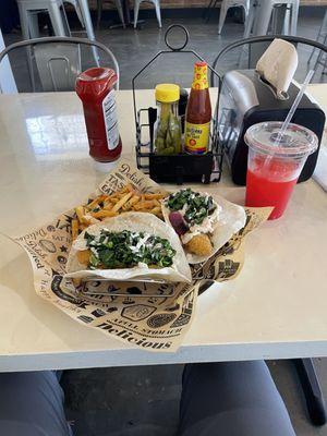 Catfish tacos with fries.