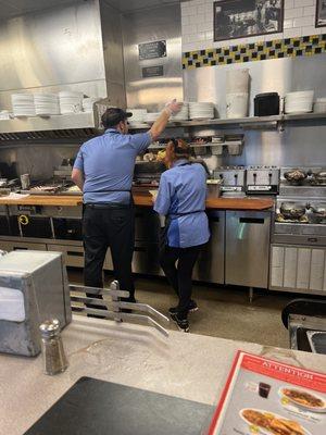 An eager cook that resorted to cleaning the grill b/c he was waiting forever for orders