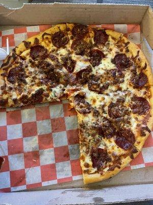 Medium thin crust pepperoni and ground beef pizza (well done).