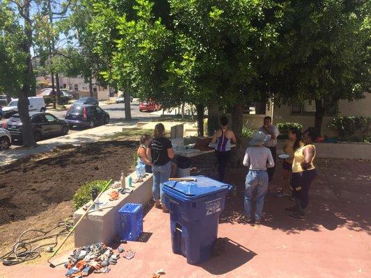 Enjoying donuts and coffee after a tending to the community garden.