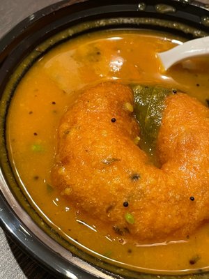 Vada dipped in Sambhar. (1 piece)