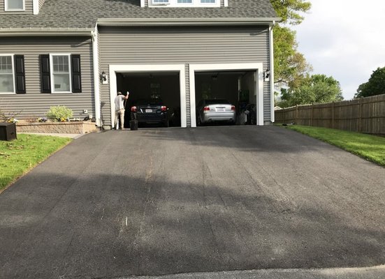 Here we are edging drive way near garage to ensure no over spray on property.