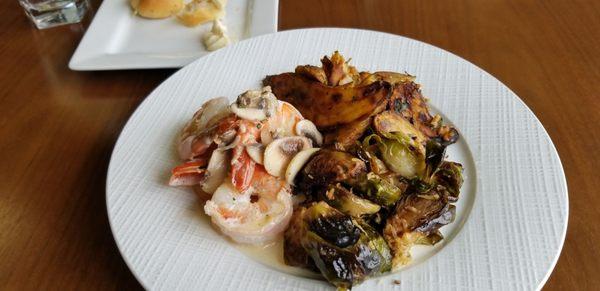 9 dollars. Shrimp w/ mushrooms, garlic potatoes, roasted Brussel sprouts.