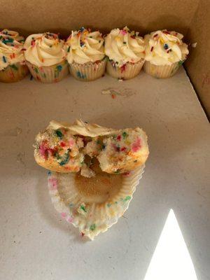 Here are the left over cupcakes with one pulled apart showing NO CREAM CHEESE in the middle!