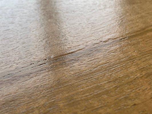 Wood laminate lifting and cracked