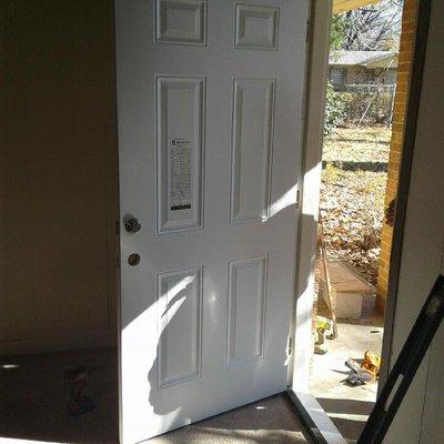 repair and installation of door jambs, trim and doors,  -After photo